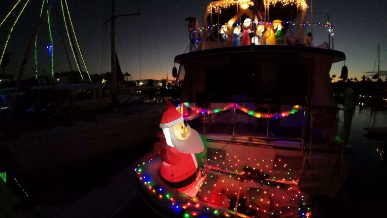 Sailboat decorated with Christmas lights at Burnt Store Marina at night