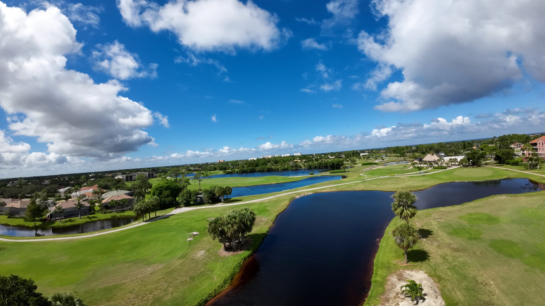 Aerial of a Burnt Store golf fairway winding past a lake