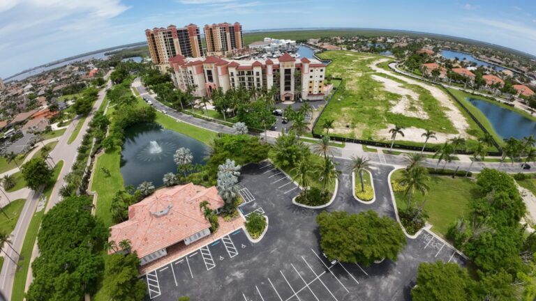 Top-down drone view of the Cape Harbour property, grounds and parking