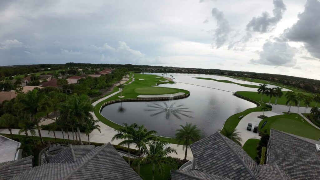 Lake fountain and fairways at Colonial Country Club, Fort Myers