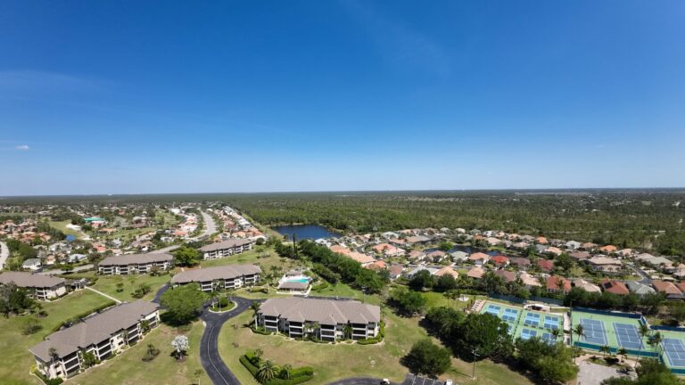 Drone overview of a condo community, tennis courts and grounds for a property survey