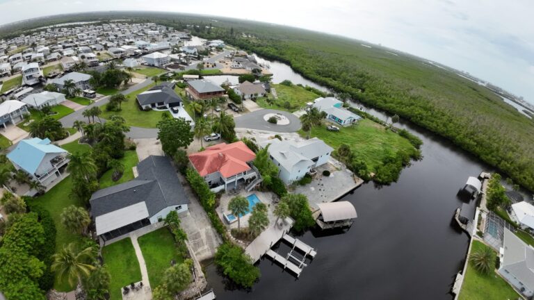 Aerial view of canal-front homes and mangroves on Fort Myers Beach