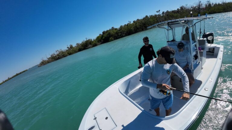 Angler fighting a fish on a Nauti Dawg Charters trip