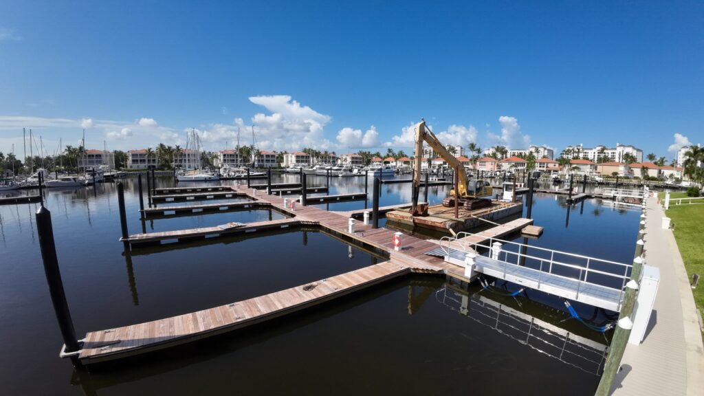 Excavator working on new docks in the North Basin, August 2026