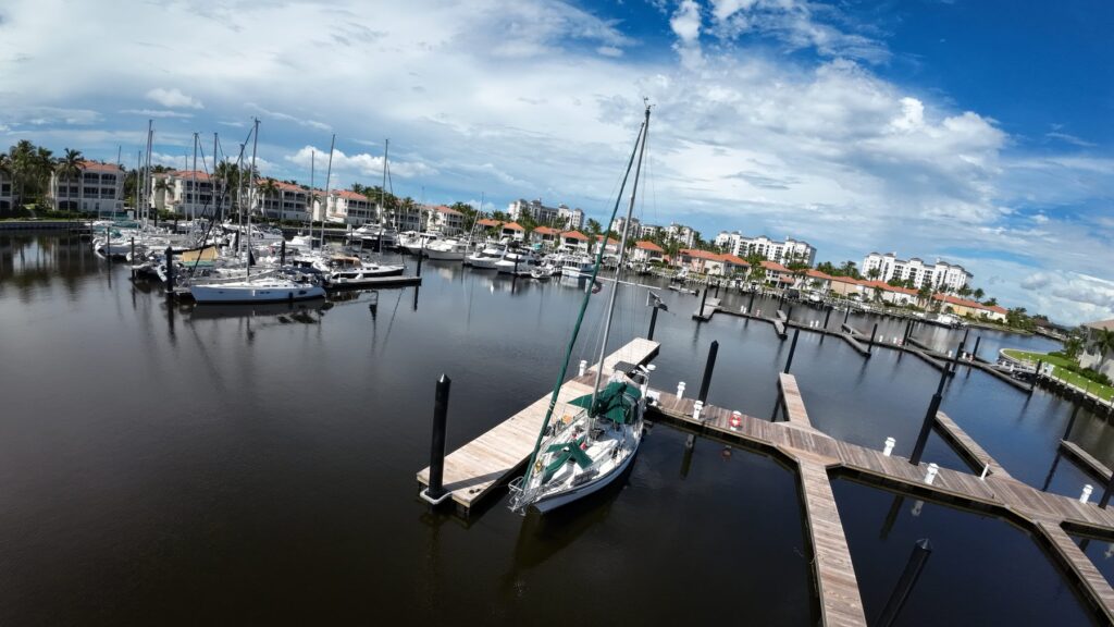 Finished new docks with a sailboat in the North Basin, September 2026